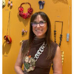 The back wall of Patina featured a special exhibition of spectacular Korean art jewelry, curated by Charon Kransen for NYC Jewelry Week. Here, Buchsbaum stands in front of it. She wears a necklace by the Italian artist Monica Cecchi, photo: Nathalie Mornu