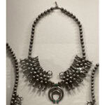 Following contact with the Spanish, we see metal work, including techniques such as stamping, filigree, and casting in tufa. Work was primarily made from silver coinage. This example of a Navajo squash blossom necklace by Slender (a.k.a. Slim) Maker of Silver (that’s his Anglo name) was in the jewelry gallery, which Lidchi gave us a private tour of. Maker of Silver was among the very first Navajo silversmiths, photo: Nathalie Mornu