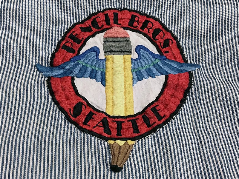 Embroidered Pencil Brothers emblem, collection of the estate of LWL, photo courtesy of Autumn Brown