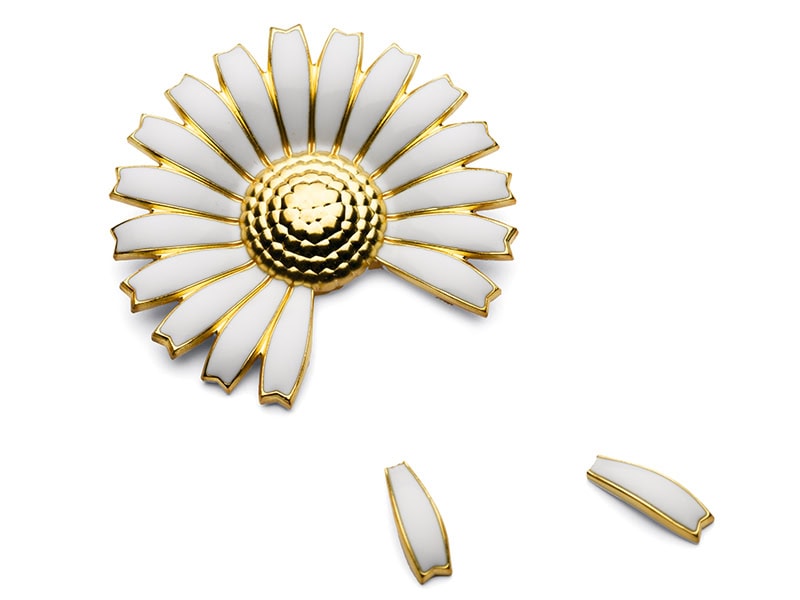 Kim Buck, Loves Me, Loves Me Not, 2007, brooch and pins in a manipulated Georg Jensen brooch, gilded silver with enamel, brooch 1 ¾ inches (44 mm), pins ⅝ inch (15 mm), photo: Anders Sune Berg