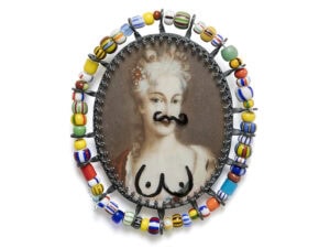 Geraldine Fenn, Colonial Comeuppance I, 2022, brooch in silver, found object (vintage painted miniature), glass, glass trade beads, steel pin, photo courtesy of the artist