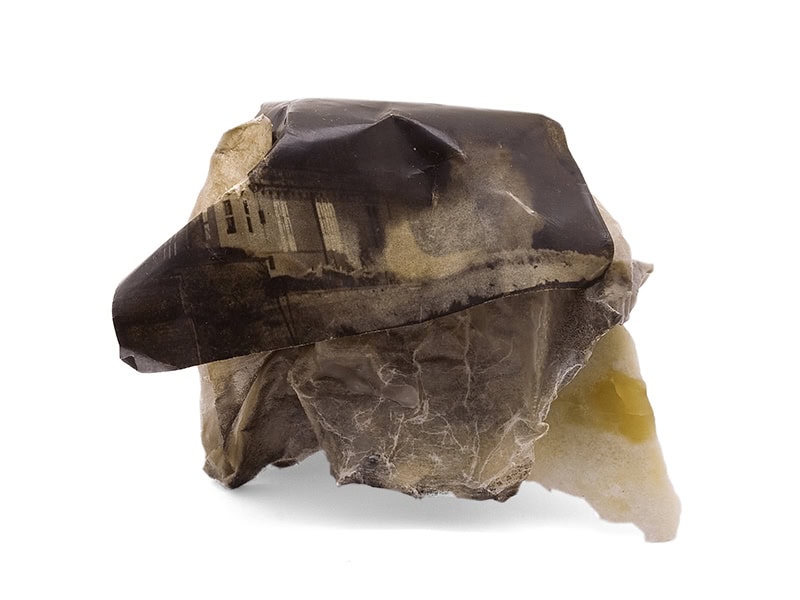 Katharina Dettar, Memento Mori I, 2008, brooch in paper, photography, serpentine stone, wax, paraffin, silver, pigment, photo: Manu Ocana