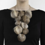 “It is my strong opinion that we need to treasure [lives] once lived and make the most of what we harvest,” states Hellman. “I strive to give my refined material the voice to convey that and let my hands provide wordless jewelry with a language.” | Caption: Marianne Hellman, Can You Hear Me?, necklace in the fat-tanned interior of moose ears, silver, thread, photo: Hanna Klintskär