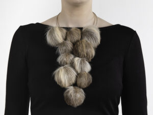 “It is my strong opinion that we need to treasure [lives] once lived and make the most of what we harvest,” states Hellman. “I strive to give my refined material the voice to convey that and let my hands provide wordless jewelry with a language.” | Caption: Marianne Hellman, Can You Hear Me?, necklace in the fat-tanned interior of moose ears, silver, thread, photo: Hanna Klintskär