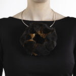 Hellman has learned and is preserving craft traditions such as tanning, combining an invaluable passed-on knowledge with new methods. | Caption: Marianne Hellman, Family Fox, necklace in bark-tanned fox ears, silver, glue, photo: Hanna Klintskär