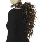 In this body of work, Hellman investigates her own valuation of different species, as well as the various parts of a nonhuman body. She evaluates her capacity for redefining values. “I see the need to reconnect the material with its source,” she explains, “revealing lost human responsibilities.” | Caption: Marianne Hellman, Meet Sven, necklace in rooster feathers, copper, eggshell porcelain (eggshell, seaweed), photo: Hanna Klintskär