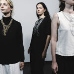 “The technique of crocheting—often regarded as one of the lowest forms of handcraft—is elevated through its translation into metal, a process that simultaneously questions this very valuation,” states Finck. “The repetition of the work across different metals, each with the same weight and equivalent invested labor time, combined with identical pricing, highlights the varying degrees of worth attributed to the same labor.” | Caption: Svea Finck, rEpeATMe, 2025, necklaces, models: Elisabeth Pira, Rune Vervoort, Jeske Druijts, photo: Saverio Sammartino