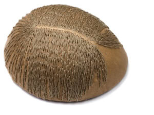 Karin Roy Andersson, Beige Middle Part I, 2025, brooch in naturally tanned reindeer skin, coconut, thread, synthetic tendon string, steel, 4 ½ x 3 ½ x 2 inches (115 x 90 x 50 mm), photo courtesy of the artist