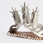 This collection, states Codigo23, is born from the experience of being a woman in northern Mexico, where machismo and sexism remain an oppressive force. ||| Codigo 23, Avenger's Trilogy, 2024, hand piece in lost wax, embroidery, white alloy, recycled cow leather and silver, 5.5 x 7.9 x 2.7 cm, photo courtesy of the artist