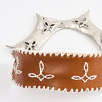“This collection offers a sense of peace by providing women with tangible tools of protection and empowerment,” says Codigo23. “Each piece is designed not only to defend but also to instill confidence and security in its wearer. By reclaiming symbols historically tied to control and oppression, the collection transforms fear into strength and vulnerability into resilience. It is a reminder that peace can be found in the power to stand firm and assert one’s right to safety and autonomy.” ||| Codigo 23, Warrior's Knee Guard, 2024, knee piece in lost wax, embroidery, white alloy, recycled cow leather, 8 x 14.6 x 0.9 cm, photo courtesy of the artist