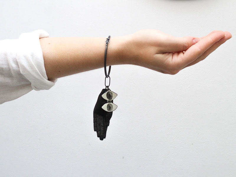 Iris Eichenberg (+Jimena Rios), Taurus III, bracelet in oxidized silver, enameled copper, wood, Chinese ink, photo: Luana Ferreiro