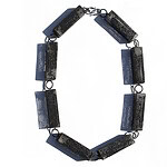 “Inspired by the symbiosis of lichen,” says the artist, “I create hollow forms with steel mesh and enamel. Like lichen, these materials support one another, bringing strength and structure to the work. I invite viewers to contemplate the shadows within these shapes—what is revealed and what is contained. Over the years of working with this medium, a common thread continues to guide me: the exploration of our interconnectedness and our place within a larger network beyond ourselves.” ||| Sandra Salaices, Rectangles Necklace, 2021, in steel, vitreous enamel, 24 inches long (each component measures 2 ¼ x ⅝ inches), photo courtesy of the artist