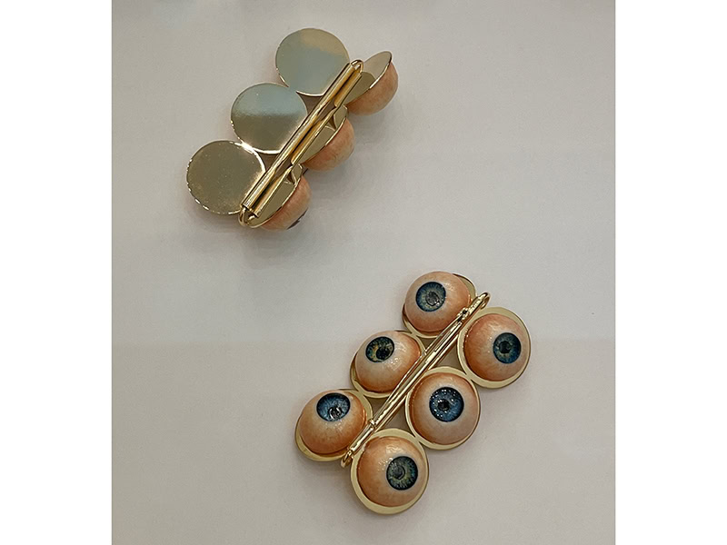 Gyuri Kim, Peep, 2025, brooches in gold-plated brass, polymer clay, acrylic paint, UV resin, at Pinakotek der Moderne, Munich, Germany, photo: Kellie Riggs