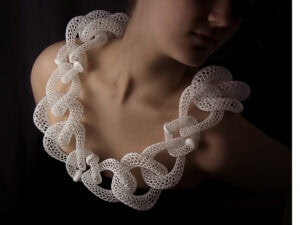 Doug Bucci, Islet Series, neckpiece in biocompatible resin, medical-grade stainless steel, titanium, gold, silver; 3D printing, photo: Ken Yanoviak