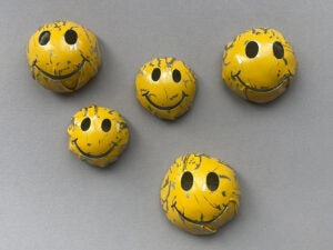 Alexander Blank, Smiley, since 2007, brooch in stainless steel, paint, 1 ⅝ x 1 ⅝ x ¾ inches (40 x 40 x 20 mm), photo: artist