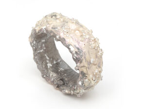 Luca Àdie, Milky Way, 2025, bangle in discarded aluminum, paint, binder, paint, zircon, diamonds, stones from Idar, photo: Mirei Takeuchi, edited by artist