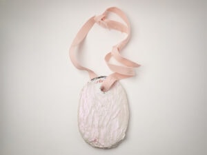 Luca Àdie, Burnout, 2025, neckpiece in Vogue, spit, blood, gold, cord, binder, paint, photo: Mirei Takeuchi, edited by artist