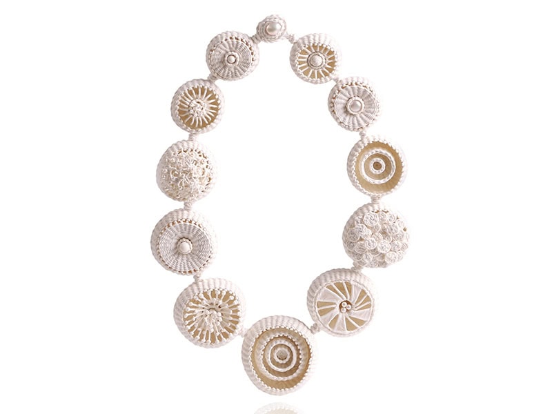 Eunhee Cho, My Nature Necklace, in hanji paper, pearl, volcanic stone, approximately 25 inches (635 mm) long, center circle approximately 2 ½ inches (64 mm) in circumference, photo courtesy of Pistachios