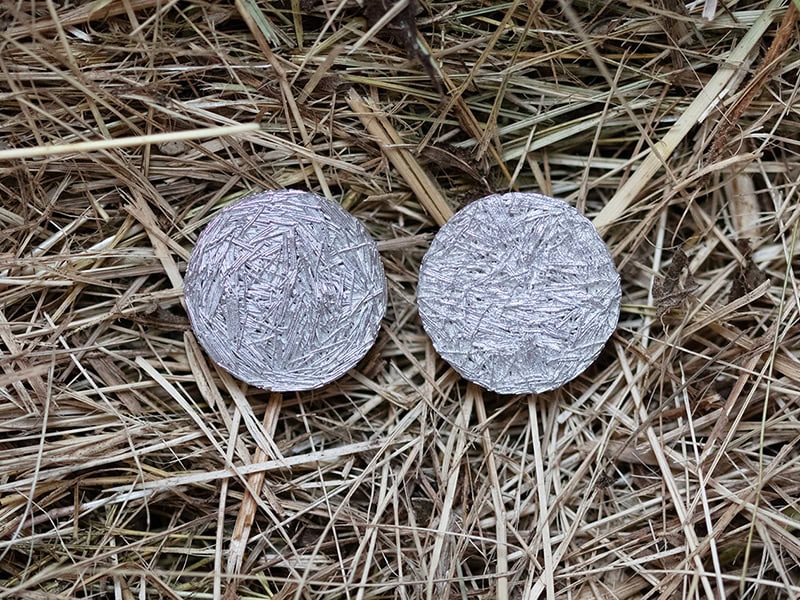 Jolynn Santiago, Field Clippings Earrings I, 2025, in hand-cut sterling silver wire and fine silver sheet, ¾ x ¾ x ⅛ inches (19 x 19 x 3 mm), photo: artist