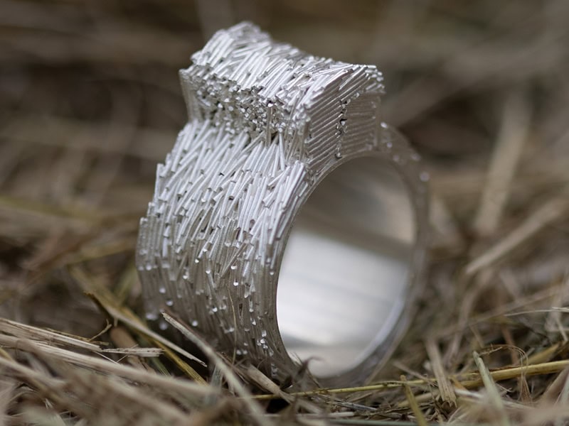 Jolynn Santiago, Field Clippings Earrings I, 2025, in hand-cut sterling silver wire and fine silver sheet, ¾ x ¾ x ⅛ inches (19 x 19 x 3 mm), photo: artist