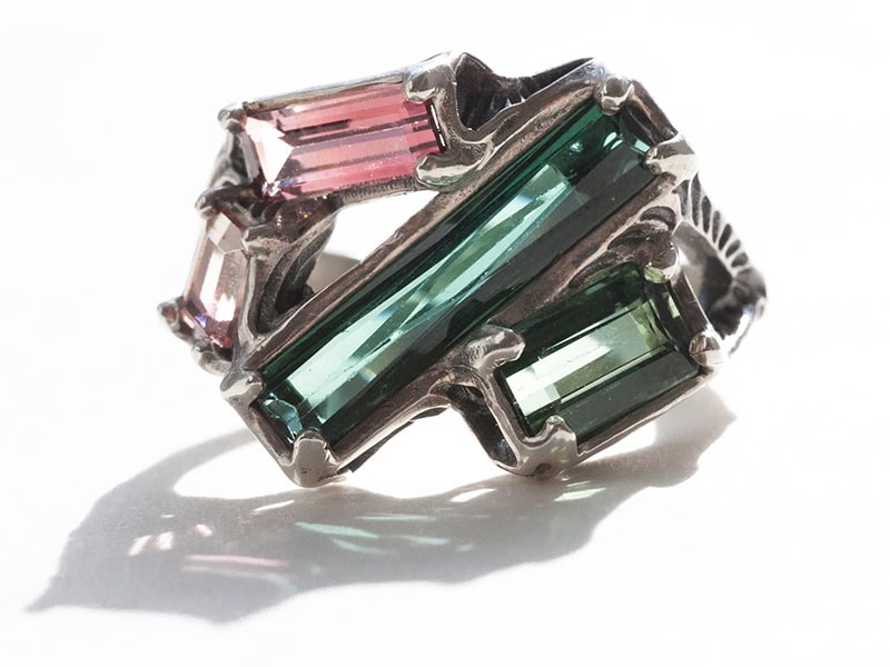 Kathleen King, Tumbling Tourmaline Ring, 2018, in sterling silver, liver-of-sulfur patina, emerald-cut indicolite, green baguette tourmaline, pink tourmaline, size 8.25, photo courtesy of Gravers Lane Gallery