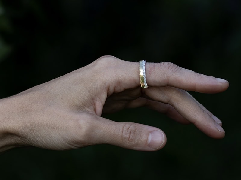 Jolynn Santiago, Ring of Pollen: 201 Microns, 2025, ring in hand-cut 18-karat yellow gold and sterling silver “dust,” size 5.5, photo: artist