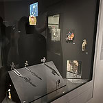 Several pieces in this case salute all who play ball. Winfried Krüger's set of two-piece brooches (silhouettes with shadows in the center) was inspired by a children's soccer game the artist witnessed one evening near his Berlin apartment. One part of the brooch captures the kid's silhouettes, while the other represents their shadows, lengthening in the setting sun. In Munster Da Vinci (center top) and (to its right) Cellini with Ball, Gijs Bakker examines the idolization of professional athletes. Bakker combined pictures of the professional soccer player Krzysztof Bociek (who pulled his jersey over his head after he scored a goal) with revered Renaissance images. Through this unexpected juxtaposition, Bakker raises questions about sports as a religion, photo: Elena Karpilova