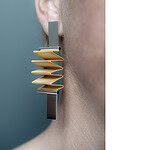 Here is one of the gallery's latest sculpture-to-wear projects: The "Plis" earrings, by French architect Gaëlle Lauriot-Prévost, made of gold-plated metal mesh, sterling silver, and black resin. Gaëlle is Dominique Perrault's partner. Together, they own one of the most successful architecture firms in France and abroad, photo courtesy of Galerie MiniMasterpiece