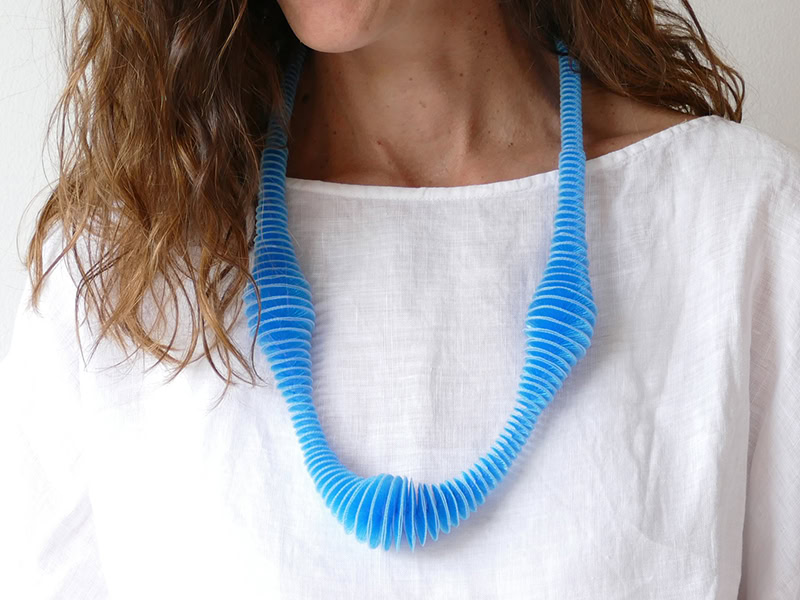 Anke Hennig has transformed a traditional German textile technique called Häkelgalon. She uses the 19th-century braiding technique and a variety of threads and filaments to make ethereal jewelry. | Anke Hennig, Hybrid III Turquoise, necklace in filaments, photo courtesy of the artist