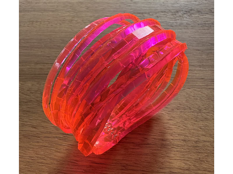 Kath Inglis, Selenium Pink Waterhole Cuff, 2025, in selenium PVC, sterling silver detail, 1 ¼ inches (33 mm) x 2 ½ inches (65 mm) in diameter, photo: Jane Bowden