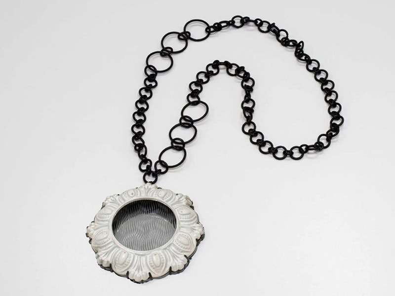 Ildikó Dánfalvi, I Really Wanted…, from the Mirroring of Traces series, 2024, necklace in steel, lacquer, Plexiglas (with guilloché), 19 ⅝ x 3 ½ x ⅝ inches (500 x 90 x 15 mm), photo: courtesy of the artist and Galerie Door