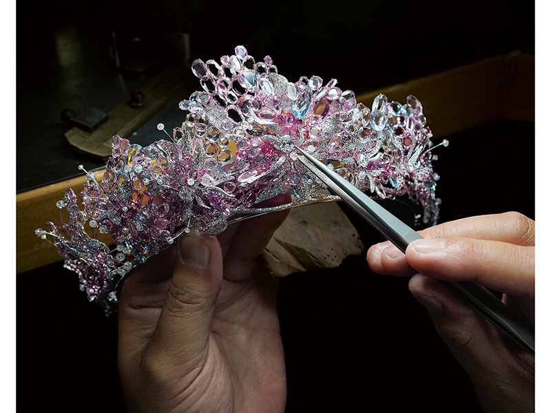 Feng J (shown on page 106 of The Jewelry Book). Image credit: J.N. Luc. A Feng J tiara in the process of being crafted with double rose-cut pink sapphires, purple sapphires, white sapphires, pink spinels, aquamarines, diamond beads, and white diamonds set with her signature floating technique in 18-karat gold, 2021