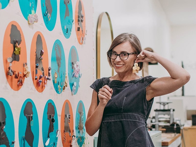 Heidi has been doing Earrings Galore for many, many years. Here is Heidi with the display in 2022. It develops and grows each year!