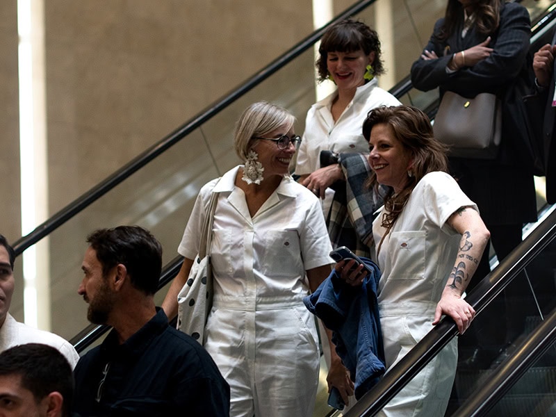 Earrings Galore traveled to Mexico City forthe second time in 2025. Heidi approached this showing in a new, exciting way. Her group, consisting of friends and artists, wore matching white jumpsuits and earrings from the show while they set upon the Zono Maco art fair. They spread the word about Earrings Galore and invited the public to the opening at Iker Ortiz's gallery. In this image, Heidi, Jess Tolbert, and Kerianne Quick are seen wearing white jumpsuits, photo courtesy of Heidi Lowe Gallery