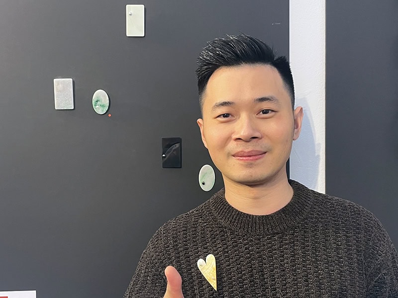 Zhipeng Wang in front of the work from his application to the 2026 Young Artist Award, on display in Platina's booth during the Handwerk and Design fair, photo: Nathalie Mornu