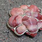 Hansen uses discarded plastics. The pieces are shaped through processes of heat and pressure, using self-constructed tools alongside traditional jewelry and silversmithing techniques, which is something she refers to as plasticsmithing. | Siri Hansen, Brooch 16, 2026, in discarded plastics, sterling silver, stainless steel, photo: artist
