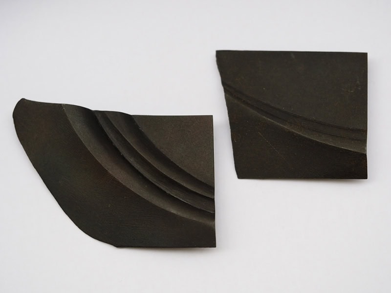 Viktor Kalinowski, Brooches, 2020, in Corten steel, stainless steel pins, (left) 2 ½ x 1 ¾ x ¼ inches (65 x 43 x 5 mm), (right) 1 ⅞ x 1 ⅝ x ¼ inches (48 x 42 x 5 mm), photo: Jane Bowden