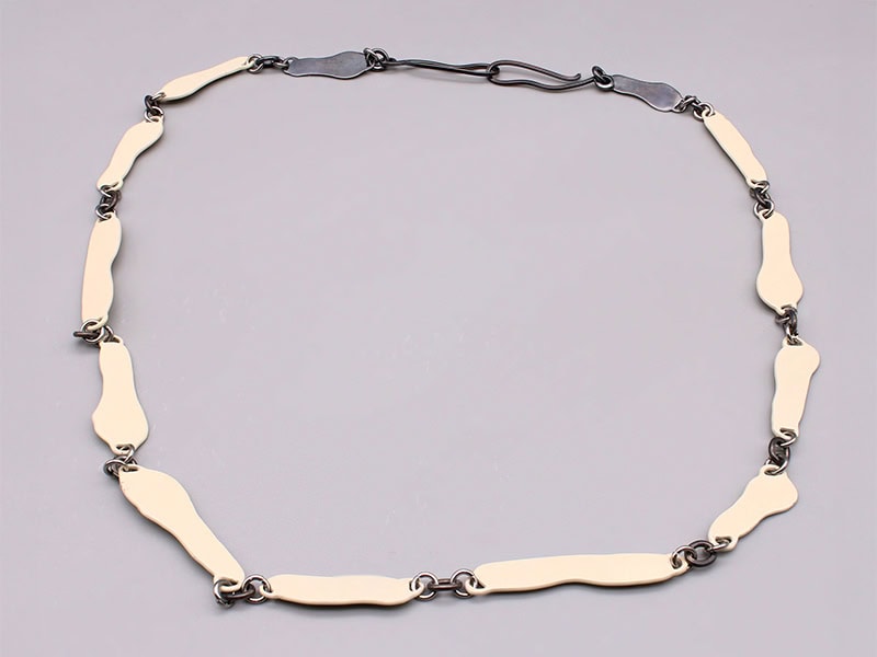 Kelly Temple, Follicle Necklace: Cream and Silver, 2022, necklace in brass, powder coat, silver, stainless steel, 22 inches (559 mm) in circumference, photo: artist
