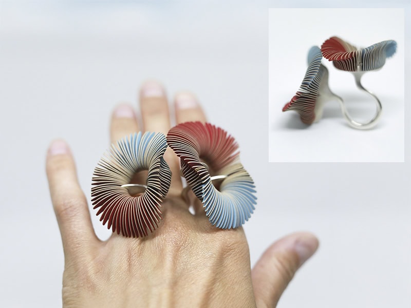 Lucie Popelka Houdková, Untitled, 2026, ring in paper, stainless steel, silver 925, approximately 2 ¾ x 2 ⅜ x 2 ⅛ inches (70 x 60 x 55 mm), adjustable size, photo courtesy of WAM!