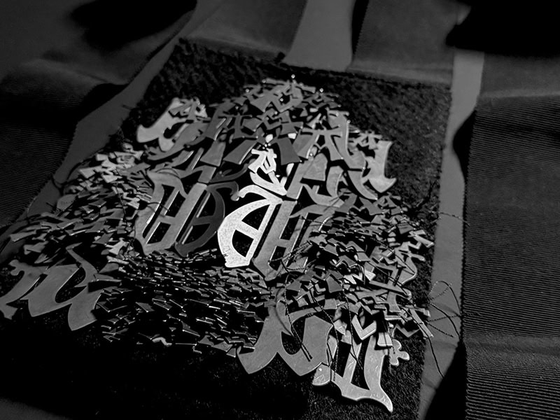 Lori Talcott, Grimoire (detail), 2025, neckpiece in oxidized silver, wool, vintage ribbon, 19 x 6 ½ x 1 ½ inches (483 x 165 x 38 mm), photo: artist