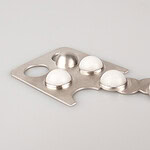 A pendant inspired by a blister pack of ibuprofen—which you may need after a big blowout bash. | Alice Kupri, Left to Be Forgotten, 2026, hand-fabricated silver set with quartz, photo: artist