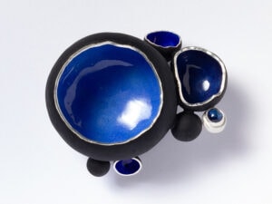 Sarah Perkins, Mushroom Brooch, 2026, in sterling silver, enamel, sapphire, photo courtesy of Mobilia Gallery