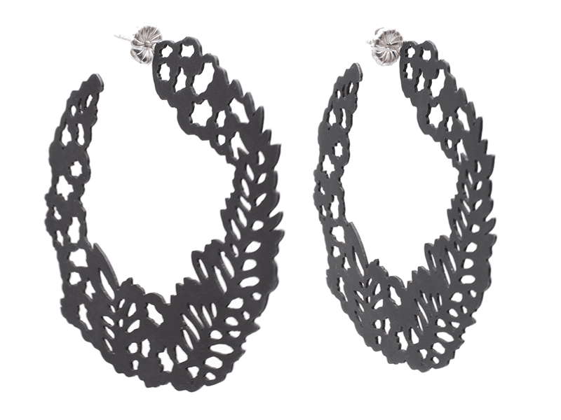 April Wood, Circle Fern Hoops, 2023, earrings in steel, sterling silver, 1 ½ x 2 ½ x ⅛ inches, photo: J Diamond