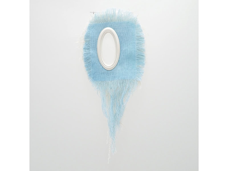 Gitte Nygaard, Dogger Bank II, brooch in organic wool, plant-dyed silk with weld (reseda), cotton, Japanese washi and gampi paper, denim and hemp denim dyed with indigo, Nakachu silk thread, silver, stainless steel pin. 7 ⅝ x 3 ⅛ x ⅜ inches (195 x 80 x 11 mm), photo courtesy of Objects Beautiful