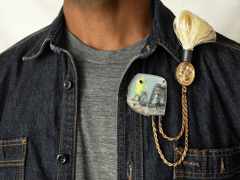 Melanie Denis, Vierge Reliquary for an Impossible Mother II, 2026, brooch in sterling silver, steel, brass, plastic, Plexiglas, photography, ink, silk, recycled fantasy jewel, relic, 180 x 80 x 20 mm, photo: Madison Hoffman and Auriele Gould