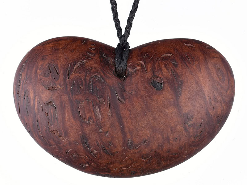 John Ecuyer, Kina/Abundant series, 2026, pendant in jarrah burl wood (from Western Australia), 4 ⅛ x 2 ½ inches (104 x 65 mm), photo: Michael Couper