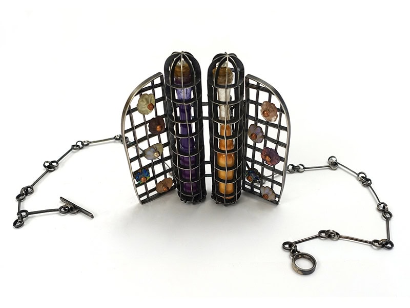 Daniel Kruger, Untitled, 2025, necklace in glass vials containing Hindu ritual pigments, pearls, glass flowers, silver, 94 x 94 x 18 mm, photo courtesy of the artist