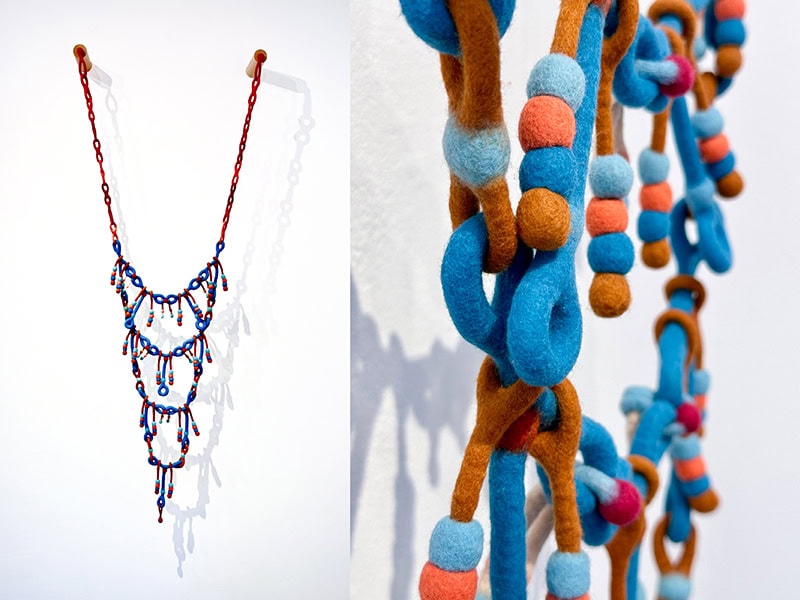 Teresa Shields, Pomponner, 2022, necklace in felted wool, hidden magnetic clasp, wood mounts 40 x 48 x 6 inches (101.6 x 121.9 x 15.2 cm), photo courtesy of the artist