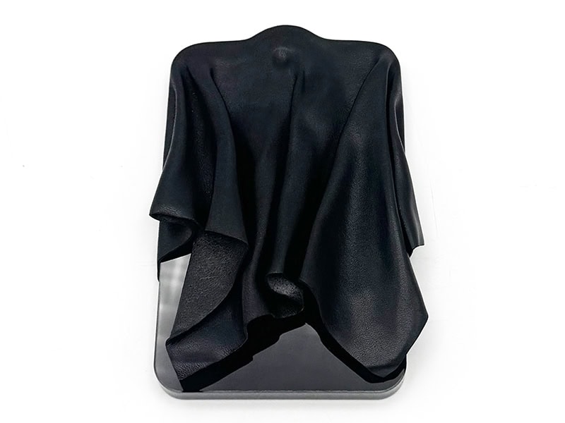 Kerianne Quick, A Denial, 2026, brooch in vegetable-tanned leather, Plexiglas, nickel alloy pin, 5 x 3 ¼ x ¾ inches, photo: Kerianne Quick